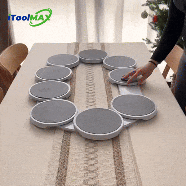 Round grey turntable trays arranged in an oval on a dining table