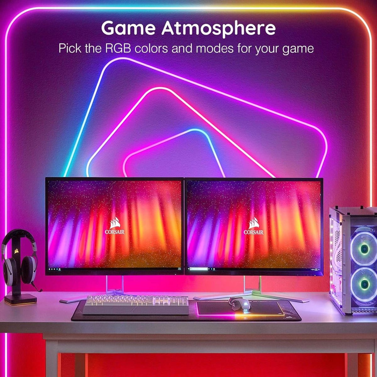 Neon rope light behind a gaming desk with two monitors, glowing in pink and purple