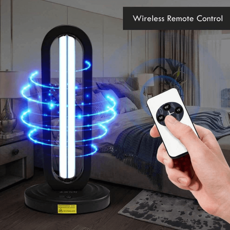 UV lamp in a bedroom with a hand pressing a wireless remote showing 15, 30 and 60 minute timers